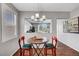 Cozy dining area with modern lighting, hardwood floors and an open view to the kitchen at 4020 Driscoll Mountain St, Las Vegas, NV 89129