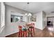 Cozy dining area with modern lighting, hardwood floors and an open view to the living room at 4020 Driscoll Mountain St, Las Vegas, NV 89129