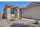 Cozy front porch with seating area and manicured landscaping at the home's entrance at 4020 Driscoll Mountain St, Las Vegas, NV 89129