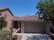 Charming single-story home with a well-maintained front yard and a two-car garage at 4020 Driscoll Mountain St, Las Vegas, NV 89129