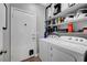 Laundry room features a washer and dryer, storage shelves and access to garage at 4020 Driscoll Mountain St, Las Vegas, NV 89129