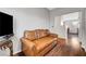 Open-concept living room with hardwood floors and modern decor at 4020 Driscoll Mountain St, Las Vegas, NV 89129