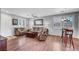 Comfortable living room features plush seating, hardwood floors and a ceiling fan at 4020 Driscoll Mountain St, Las Vegas, NV 89129