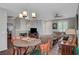 Open-concept living space with dining area, living room and fireplace at 4020 Driscoll Mountain St, Las Vegas, NV 89129