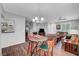 Open-concept living space with dining area, living room and fireplace at 4020 Driscoll Mountain St, Las Vegas, NV 89129