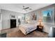 Neutral main bedroom with carpet, ceiling fan, and bright windows at 4020 Driscoll Mountain St, Las Vegas, NV 89129