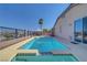 Backyard pool with elevated spa, lounge chairs and mountain views at 4020 Driscoll Mountain St, Las Vegas, NV 89129