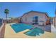 Enjoy the backyard oasis with a pool, spa, stainless steel grill, and outdoor seating area at 4020 Driscoll Mountain St, Las Vegas, NV 89129