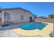 The backyard features a pool and patio space, ideal for relaxing or entertaining guests at 4020 Driscoll Mountain St, Las Vegas, NV 89129