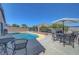 Relaxing backyard pool with mountain views and patio seating, perfect for outdoor entertaining at 4020 Driscoll Mountain St, Las Vegas, NV 89129