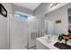 Bright bathroom featuring a shower with glass enclosure at 4020 Driscoll Mountain St, Las Vegas, NV 89129