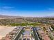 A Primary-planned community features a lush green park with mountain views at 4229 Venus Falls Ave, North Las Vegas, NV 89084