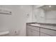Bathroom with granite countertops, white cabinets, and neutral decor at 4229 Venus Falls Ave, North Las Vegas, NV 89084