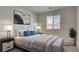 Stylish bedroom with modern art and furniture at 4229 Venus Falls Ave, North Las Vegas, NV 89084