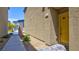 Inviting home featuring a yellow front door and a well-maintained walkway at 4229 Venus Falls Ave, North Las Vegas, NV 89084