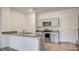 Modern kitchen with granite countertops and stainless steel appliances at 4229 Venus Falls Ave, North Las Vegas, NV 89084
