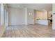 Open-concept living space with hardwood floors, leading to a modern kitchen at 4229 Venus Falls Ave, North Las Vegas, NV 89084