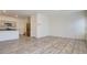 Spacious living area with hardwood floors, adjacent to the kitchen at 4229 Venus Falls Ave, North Las Vegas, NV 89084