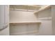 This walk-in closet is fitted with multiple shelves and clothing racks at 4229 Venus Falls Ave, North Las Vegas, NV 89084