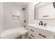 Updated bathroom featuring modern finishes, white tile, and black fixtures at 4301 Fortune Ave, Las Vegas, NV 89107