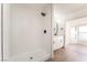 Bathroom featuring a walk-in shower with white subway tile and modern fixtures at 4301 Fortune Ave, Las Vegas, NV 89107