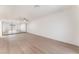 Large bedroom with hardwood floors, a ceiling fan, and a mirrored closet at 4301 Fortune Ave, Las Vegas, NV 89107