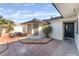 Charming courtyard with outdoor dining, desert landscaping, and stylish entryway at 4301 Fortune Ave, Las Vegas, NV 89107
