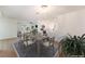 Open-concept dining area with modern table set and views into the renovated kitchen and backyard at 4301 Fortune Ave, Las Vegas, NV 89107