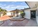 Home featuring a charming front courtyard with mature landscaping at 4301 Fortune Ave, Las Vegas, NV 89107