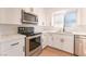Beautiful kitchen featuring modern appliances, sleek countertops, and bright lighting at 4301 Fortune Ave, Las Vegas, NV 89107