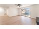 Spacious living room with wood floors, sliding glass doors to the pool, and neutral decor at 4301 Fortune Ave, Las Vegas, NV 89107