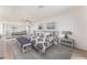Bright main bedroom with mirrored closet doors, a ceiling fan, and neutral decor at 4301 Fortune Ave, Las Vegas, NV 89107