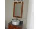 Bathroom with a vessel sink, granite countertop, wood cabinet, and a framed mirror at 4575 Dean Martin Dr # 3206, Las Vegas, NV 89103