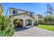 Spacious backyard featuring a covered patio, outdoor kitchen, seating area, artificial turf, and basketball hoop at 459 Astillero St, Las Vegas, NV 89138