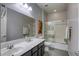 Well-lit bathroom featuring a large vanity with double sinks and a shower-tub combination at 459 Astillero St, Las Vegas, NV 89138
