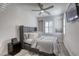 Comfortable bedroom features a plush bed, stylish nightstand, and a modern ceiling fan at 459 Astillero St, Las Vegas, NV 89138
