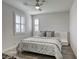 Serene bedroom featuring shutters, neutral decor, ceiling fan, and a comfortable queen-sized bed at 459 Astillero St, Las Vegas, NV 89138