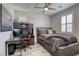 Inviting bedroom with desk, computer, ceiling fan, shutters, and a comfortable platform bed at 459 Astillero St, Las Vegas, NV 89138