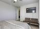 Cozy bedroom with plush seating, a mounted television, and a comfortable bed at 459 Astillero St, Las Vegas, NV 89138