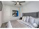 This bedroom features a queen-sized bed with decorative pillows and contemporary artwork at 459 Astillero St, Las Vegas, NV 89138
