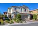 Beautiful two-story home with a two-car garage, manicured landscaping, and a welcoming entrance at 459 Astillero St, Las Vegas, NV 89138
