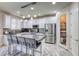 Spacious kitchen features an island with seating, modern appliances, walk-in pantry and stylish tile flooring at 459 Astillero St, Las Vegas, NV 89138