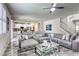 Spacious living room with a large gray sofa, open to the kitchen, perfect for modern living at 459 Astillero St, Las Vegas, NV 89138