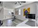 Upstairs loft featuring gray wood flooring, exercise equipment, and a bright open workspace at 459 Astillero St, Las Vegas, NV 89138