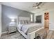 Elegant main bedroom featuring plank floors, a ceiling fan, and a walk-in closet at 459 Astillero St, Las Vegas, NV 89138