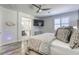 Bright main bedroom with ensuite bathroom, featuring plank floors and a mounted television at 459 Astillero St, Las Vegas, NV 89138