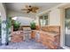 Covered outdoor kitchen featuring wood accents, a built-in grill, and convenient sink with stylish design at 459 Astillero St, Las Vegas, NV 89138
