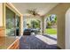 Covered patio with beautiful stone flooring, comfortable seating, and a view of the landscaped backyard at 459 Astillero St, Las Vegas, NV 89138