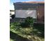 Green backyard features privacy screening and neatly manicured landscaping at 461 N Lamb Blvd # H, Las Vegas, NV 89110