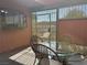 Charming patio features a glass table and metal chairs for outdoor living at 461 N Lamb Blvd # H, Las Vegas, NV 89110